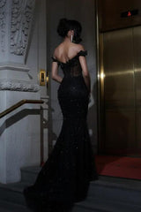 Back view of the black mermaid prom dress showing the zipper back and sweeping train