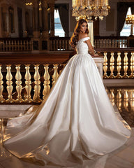 A Line Off the Shoulder Sweetheart Backless Satin Wedding Dress with Ruffles and Appliques