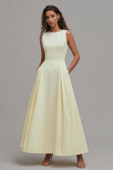 Daffodil satin A-line prom dress with a sleeveless crew neck bodice and pleated floor-length skirt with pockets