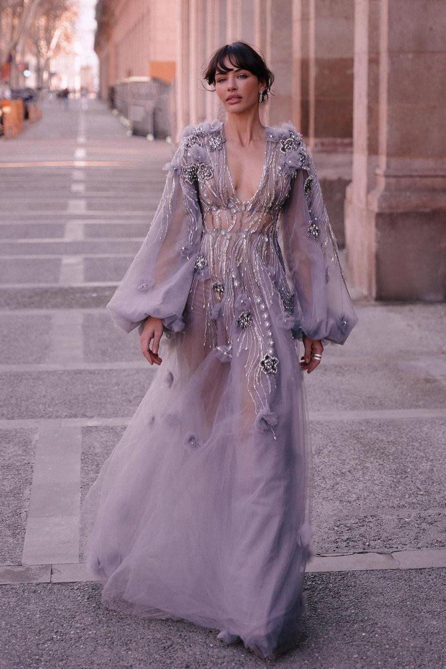 Sheer long sleeve tulle A-line prom dress with plunging V-neck and beaded 3D floral bodice, full length front view