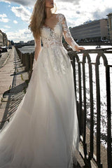 Illusion Neck A Line Wedding Dress with Long Sleeves and Sweep Train crafted from Lace and Tulle