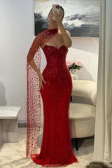 Front view of the red beaded prom dress with sheer shoulder scarf