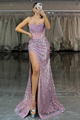 Strapless sequin mermaid prom dress with structured corset bodice and high slit, front view