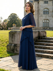 Side view of the dark navy A-line mother of the bride dress showing the tiered chiffon layers and floor-length hem.