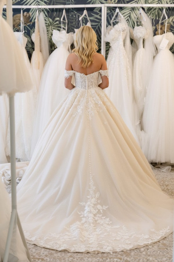 Ivory Tulle Ball Gown Wedding Dress with Off-the-Shoulder Neckline and Lace Appliques