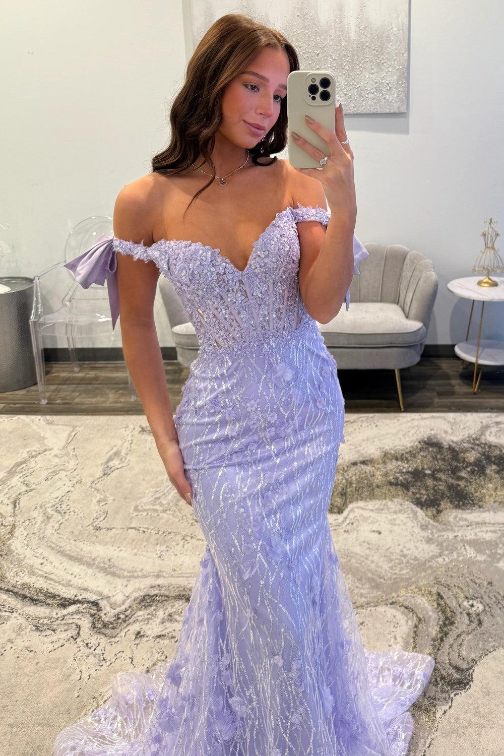 Lace bodice and off-the-shoulder neckline of the sequin mermaid prom dress with bow straps