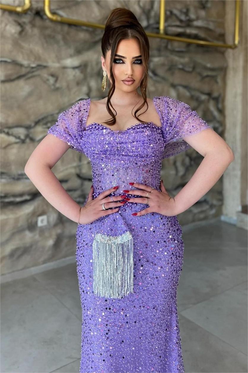 Close-up of the sequined sweetheart bodice and sheer sleeves on the purple mermaid prom dress