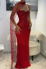 Side view of the red beaded mermaid prom dress with sheer scarf