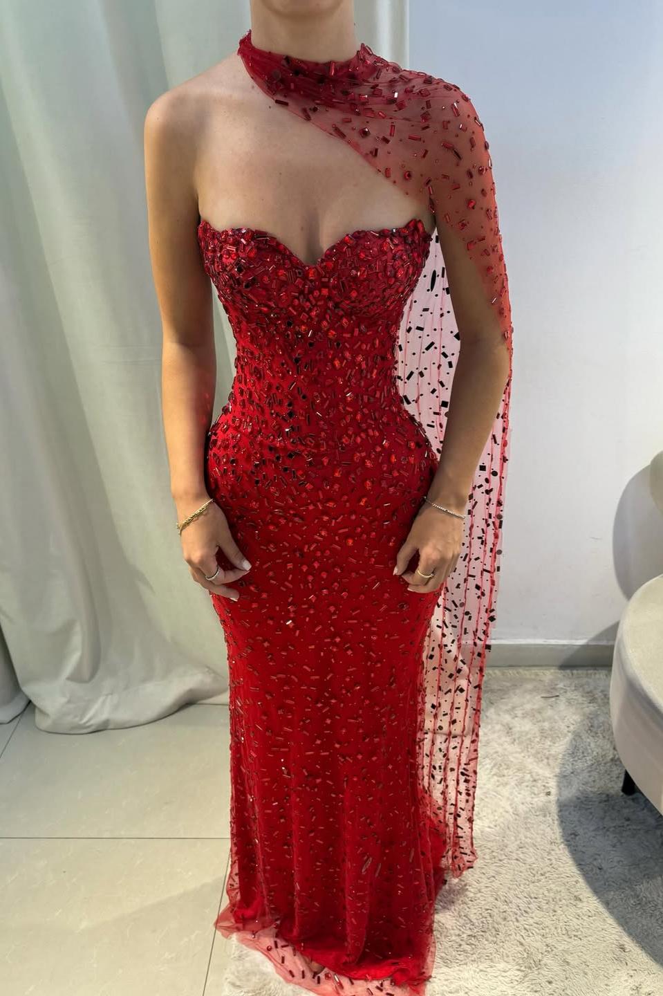 Red sweetheart bodice with intricate beading and sheer scarf