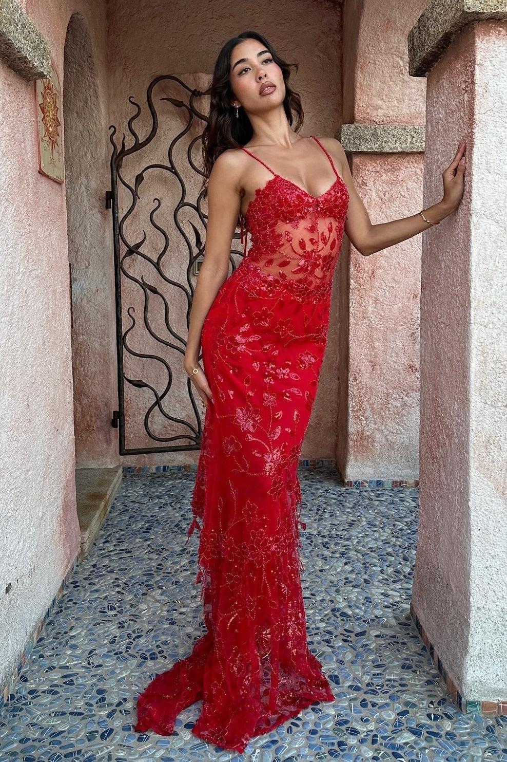 Sheer illusion bodice with floral sequin embroidery on the mermaid prom dress