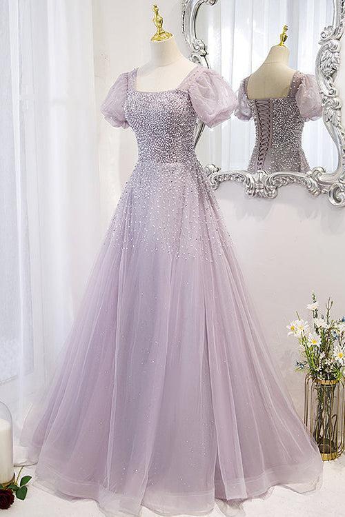 Angled view of the lilac sequin-beaded prom dress with puff sleeves and a full layered tulle skirt