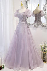 Angled view of the lilac sequin-beaded prom dress with puff sleeves and a full layered tulle skirt